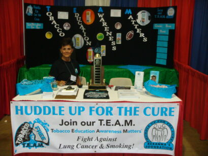 Sandy Sledge at the Huddle Up for the Cure T.E.A.M. advocacy booth, 2008